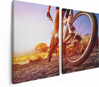 Artaza Canvas Schilderij Tweeluik Mountainbike Fietser op Stenen bij Zonsopgang - 120x80 - Foto Op Canvas - Canvas Print