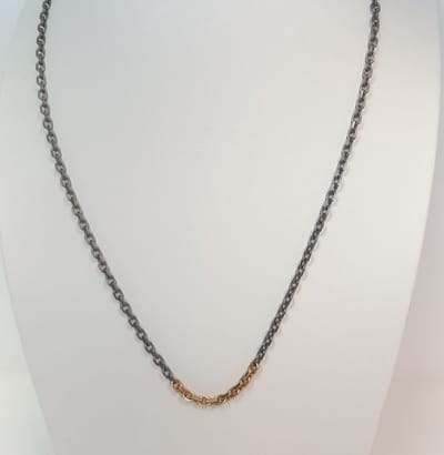 Titanium collier - 18 karaat geelgoud/titanium - 42 cm - goudgewicht 1.8 gram - model C.J.P. 71002896TG1 - uitverkoop - van €545,- voor €395,-
