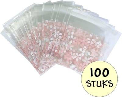 100x Cellofaan Zakjes - 100x Uitdeelzakjes - Cellofaan Plastic Traktatie Kado Zakjes - Snoepzakjes - Bloemetjes Roze/Wit - 7x7cm