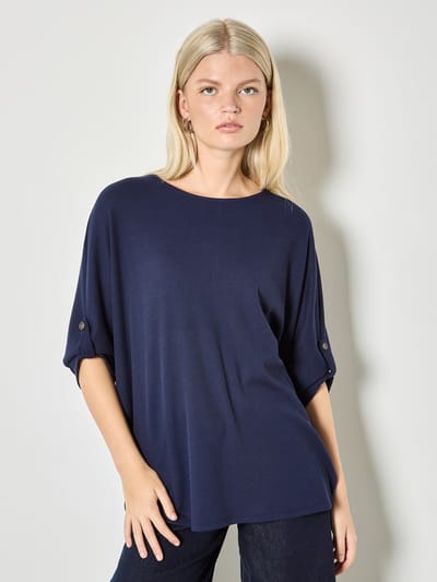 Top met knoopdetails van wafelbreisel