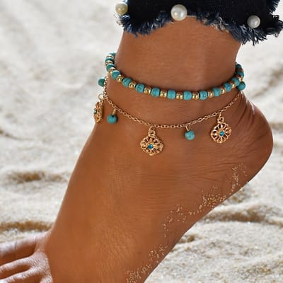 Sjika - Dubbele Enkelband Dames – Turquoise Kralen & Zilveren Bedels – Boho Enkelbandje Verstelbaar – Zomer Strand Sieraad - Cadeau voor haar
