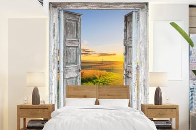 Behang - Fotobehang Doorkijk - Platteland - Landschap - Zon - Breedte 195 cm x hoogte 260 cm