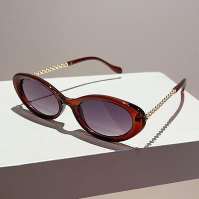Lunettes de soleil de designer haut de gamme à petite monture de forme ovale pour femmes et hommes Style rétro Élégantes Lunettes de soleil pour le soleil Tendance Punk Métal UV400