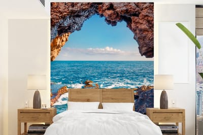 Behang - Fotobehang Grot - Zee - Rotsen - Natuur - Breedte 190 cm x hoogte 260 cm