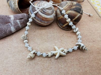 Enkelbandje - Zomer - Ibiza style - met geribde fuik Horn schelp, facet kralen, Zeester, wit kleur touw.