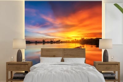 Behang - Fotobehang Boot - Water - Zonsondergang - Oranje - Water - Breedte 350 cm x hoogte 350 cm