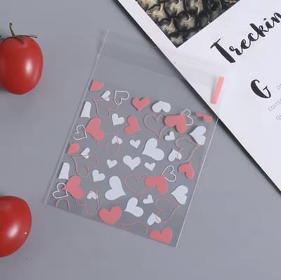 CHPN - Traktatiezakjes - Uitdeelzakjes - Snoepzakjes - Giftbags - 100stuks - Goodiebag - Transparante zakjes - Hartjes - Roze - 7/7CM