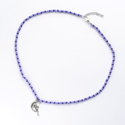 Ketting in paarstinten met elfje hanger