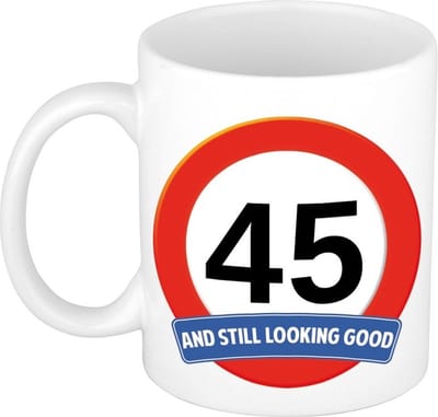 Koffie mok / cadeau beker - 45 jaar - verjaardag - still looking good - wit - stopbord - 300 ml - keramiek