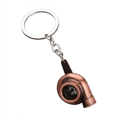 Koperkleurige sleutelhanger turbocharger vorm met metalen sleutelring en korte schakelketting, sleutelhanger voor heren en dames, compact accessoire met mechanisch ontwerp en warm industrieel detail