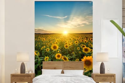Behang - Fotobehang Zonsondergang - Bloemen - Zonnebloem - Horizon - Landschap - Breedte 195 cm x hoogte 300 cm