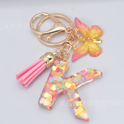 Sleutelhangers of voor je tas van A tot Z - met een pompon of kwastje - met letter - mooi design - handgemaakt - sleutelhangers - design - mode - goud - zwart - blauw - roze- rood