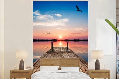 Behang - Fotobehang Steiger - Water - Zonsondergang - Roze - Horizon - Breedte 160 cm x hoogte 240 cm
