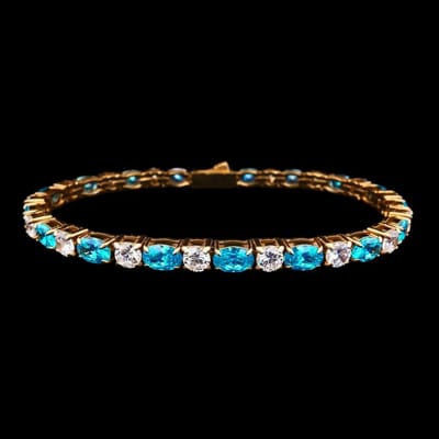 Victoria Valenza Goudkleurige RVS Tennisarmband met Blauwe Zirkonia Stenen - Armband - Goudkleurig - RVS - Tennisarmband - Zirkonia