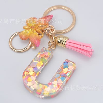 Sleutelhangers of voor je tas van A tot Z - met een pompon of kwastje - met letter - mooi design - handgemaakt - sleutelhangers - design - mode - goud - zwart - blauw - roze- rood