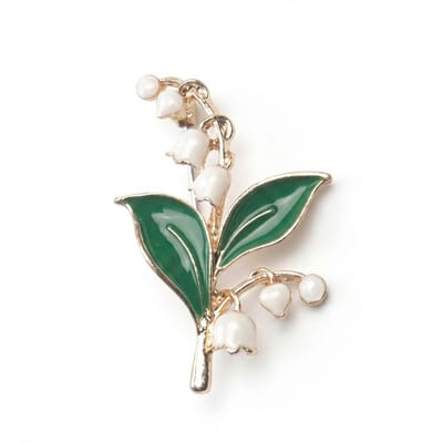 Goudkleurige bloem broche dames – metalen broche met lelietje van dalen ontwerp en groene bladeren – decoratieve speld voor sjaal, kraag, jas of kledingaccessoire