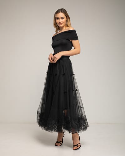 Tule midi-rok met kant aan de onderkant en strikdetails.