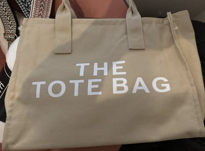 Damestas - The Tote Bag - Canvas - Beige - Witte letters - 33 x 27 cm.