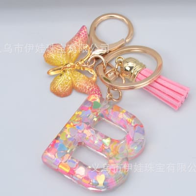 Sleutelhangers of voor je tas van A tot Z - met een pompon of kwastje - met letter - mooi design - handgemaakt - sleutelhangers - design - mode - goud - zwart - blauw - roze- rood