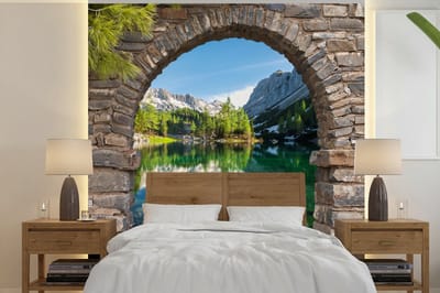Behang - Fotobehang Doorkijk - Berg - Landschap - Water - Breedte 240 cm x hoogte 240 cm