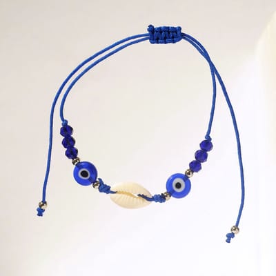 Blauw armbandje met kauri schelp en boze oog kralen