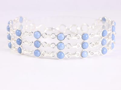 Brede zilveren schakelarmband met blauwe opaal