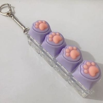 2-delige sleutelhanger met kattenpootjes | Met decompressieknop | Leuke ontwerp, geschikt voor dagelijks gebruik en accessoire-Paars