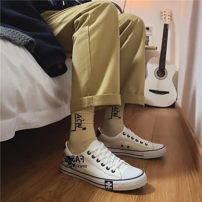 Lente en Herfst Nieuwe Canvas Schoenen Heren Koreaanse Letter Casual Schoenen Lage Top Student Herenschoenen Ademende Stoffen Schoenen 44 brown