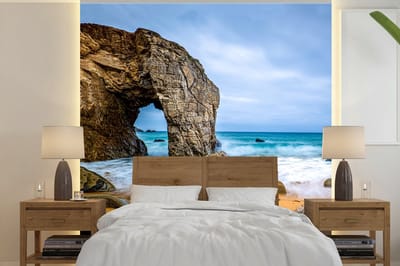 Behang - Fotobehang Stenen - Water - Strand - Rots - Golven - Breedte 220 cm x hoogte 220 cm