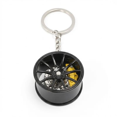 Zwartkleurige auto remschijf sleutelhanger – metalen wiel sleutel hanger – 360° roterende brake disc keychain – unisex – velg sleutelhanger met geel remklauw detail