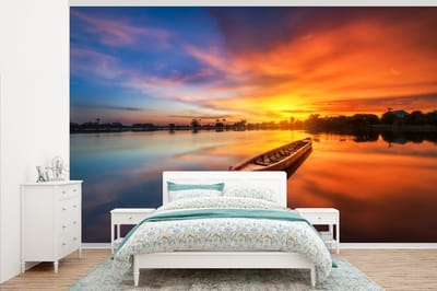 Behang - Fotobehang Boot - Water - Zonsondergang - Oranje - Water - Breedte 375 cm x hoogte 240 cm