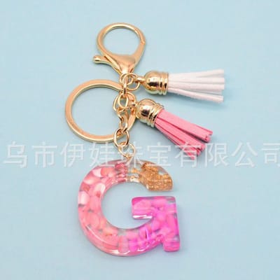 Sleutelhangers of voor je tas van A tot Z - met een pompon of kwastje - met letter - mooi design - handgemaakt - sleutelhangers - design - mode - goud - zwart - blauw - roze- rood