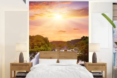 Behang - Fotobehang Waterval - Landschap - Zon - Wolken - Zonsondergang - Breedte 160 cm x hoogte 220 cm