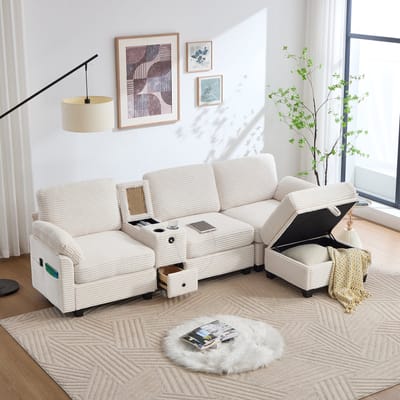 Grote corduroy bank met comfortabel schuim. Kenmerken: Verwijderbare middenconsole (2 bekerhouders + opbergruimte), USB-C-poort, zijvak, opberglade, verplaatsbare opbergpoef. Voor comfort en functionaliteit.