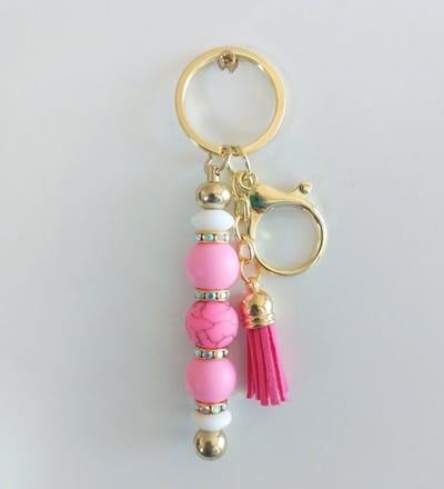 Sleutelhanger, tashanger met kralen | roze | bloem | goudkleurig