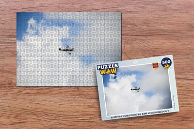 Puzzel Spitfire vliegtuig bij een wolkenlucht - Legpuzzel - Puzzel 500 stukjes