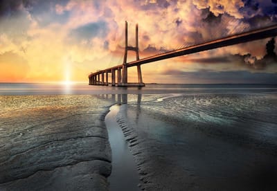 Fotobehang City Bridge Beach Sun Portugal Sunset | XL - 208cm x 146cm | 130g/m2 Vlies