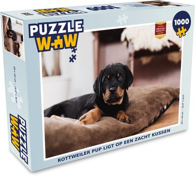 Puzzel Rottweiler pup ligt op een zacht kussen - Legpuzzel - Puzzel 1000 stukjes volwassenen