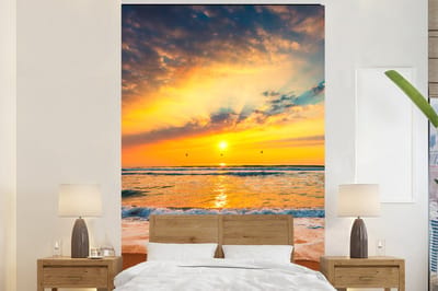 Behang - Fotobehang Zonsondergang - Strand - Zee - Wolken - Oranje - Breedte 200 cm x hoogte 300 cm