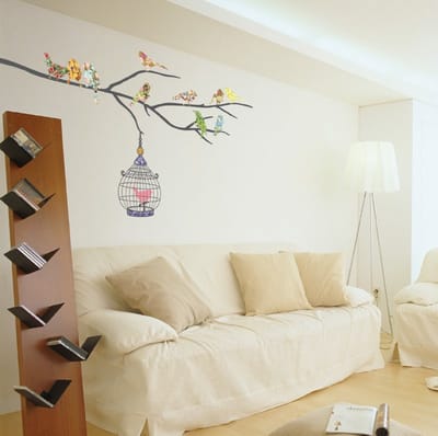 Decoratieve muurstickers: Veelkleurige vogels in een kooi