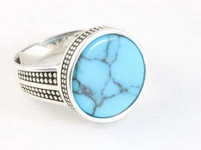 Bewerkte ronde zilveren ring met blauwe turkoois - maat 20.5