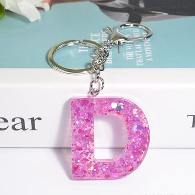 Sleutelhangers of voor je tas van A tot Z - met een pompon of kwastje - met letter - mooi design - handgemaakt - sleutelhangers - design - mode - goud - zwart - blauw - roze- rood