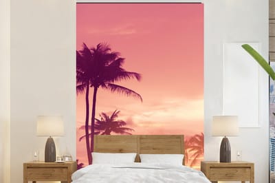 Behang - Fotobehang Lucht - Palmboom - Avond - Natuur - Tropisch - Breedte 225 cm x hoogte 350 cm