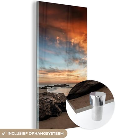 MuchoWow® Glasschilderij 20x40 cm - Schilderij acrylglas - Strand - Stenen - Avond - Lucht - Natuur - Foto op glas - Schilderijen