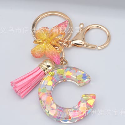Sleutelhangers of voor je tas van A tot Z - met een pompon of kwastje - met letter - mooi design - handgemaakt - sleutelhangers - design - mode - goud - zwart - blauw - roze- rood
