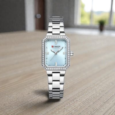 CURREN 9102 Zilverkleurig met Lichtblauwe Wijzerplaat Dameshorloge met Kristalrand en Lichtgevende Wijzers
