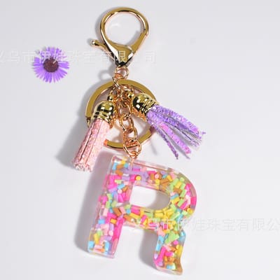 Sleutelhangers of voor je tas van A tot Z - met een pompon of kwastje - met letter - mooi design - handgemaakt - sleutelhangers - design - mode - goud - zwart - blauw - roze- rood