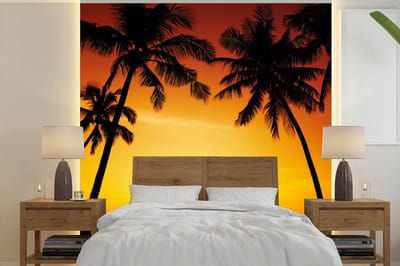 Behang - Fotobehang Palmboom - Zonsondergang - Strand - Oranje - Tropisch - Breedte 300 cm x hoogte 300 cm