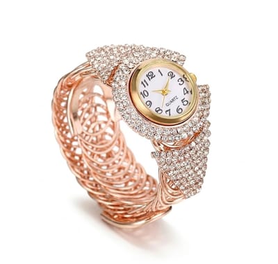 Roségoudkleurig analoog horloge dames – rond uurwerk met glanzende kristal accenten – elastische polsband met diamantlook details – quartz horloge