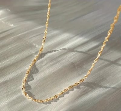 Gedraaide schakelketting - Fijne damesketting - Stainless steel goudkleurig - 2mm - Choker - The Jewellery Salon
